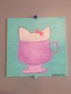 Kitty in pink cup